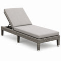 Lettino prendisole in rattan sintetico con cuscino grigio